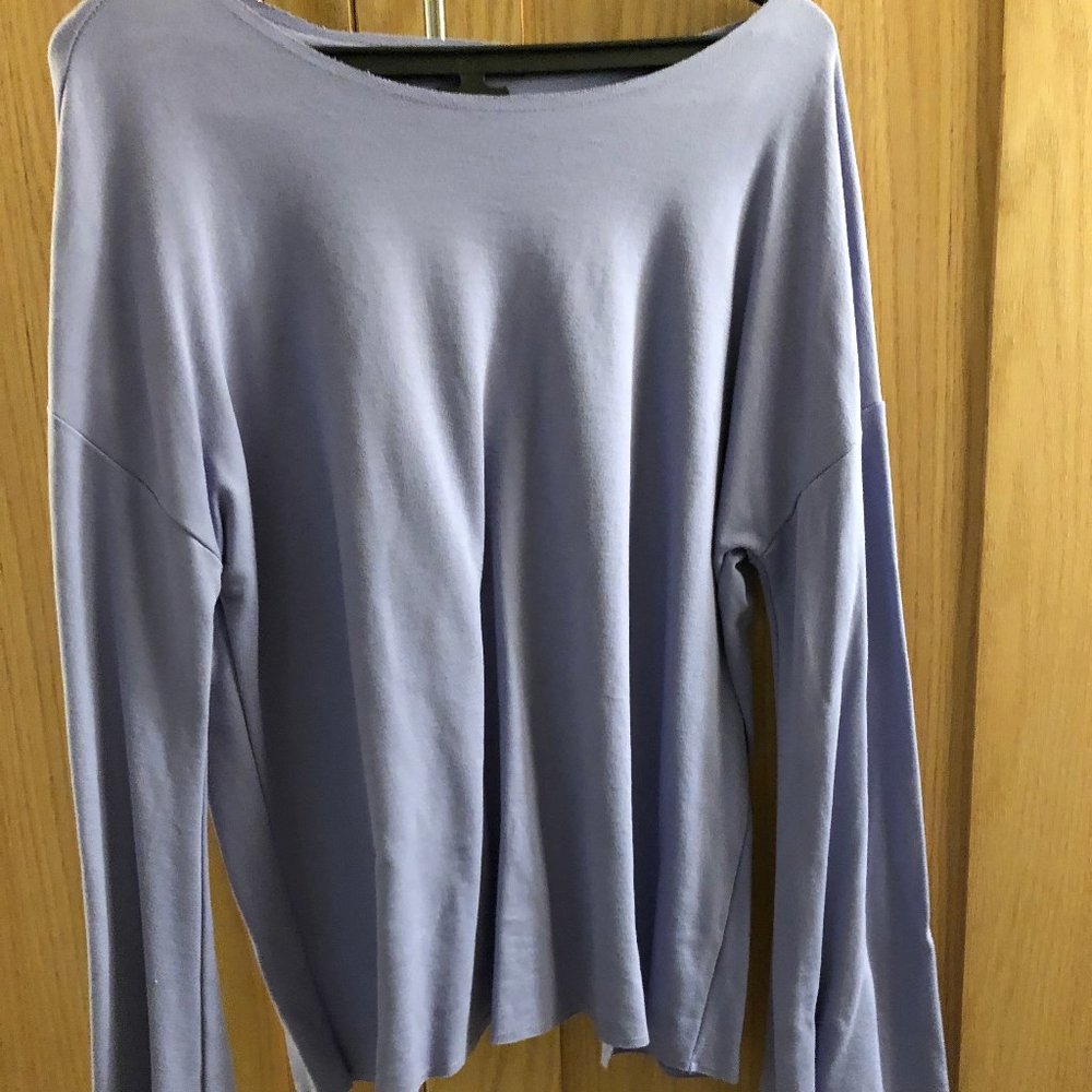 Lavendar colored top with crossed-over open back